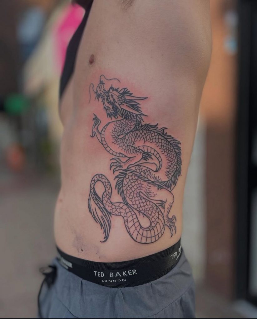 68883a69-716a-47f7-a012-487ff8c89d0f Black and grey Japanese style dragon rib tattoo by Loren at Kimmer Ink Tattoo Studio in Eastleigh, Hampshire.