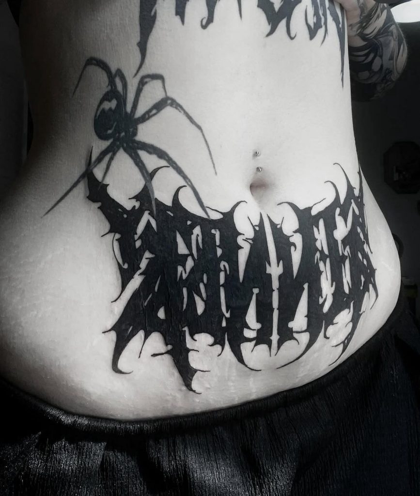 b26588e2-6884-43b1-a1c9-97f35623527b Blackmetal style script and spider stomach tattoo by Loren at Kimmer Ink Tattoo Studio in Eastleigh, Hampshire.