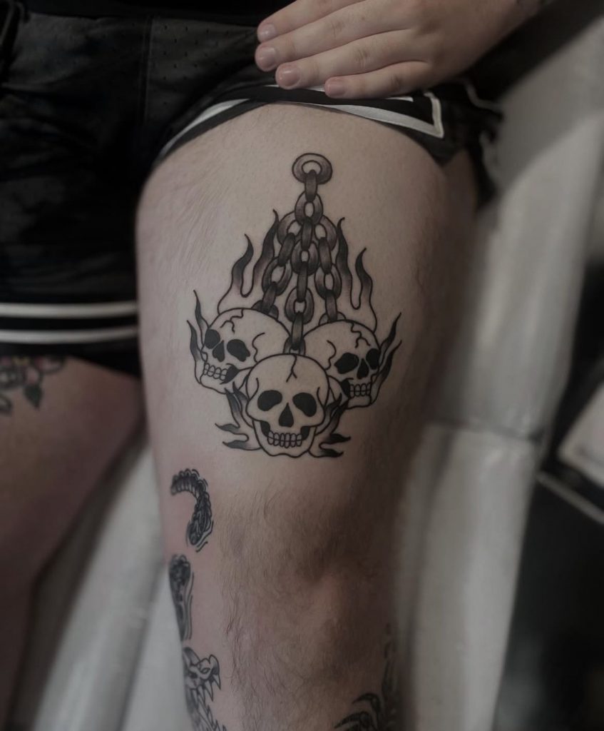 c97a9fe1-adec-4958-aee4-9d5835207e27 Black and grey traditional skull tattoo on the upper arm by Loren at Kimmer Ink Tattoo Studio in Eastleigh, Hampshire.