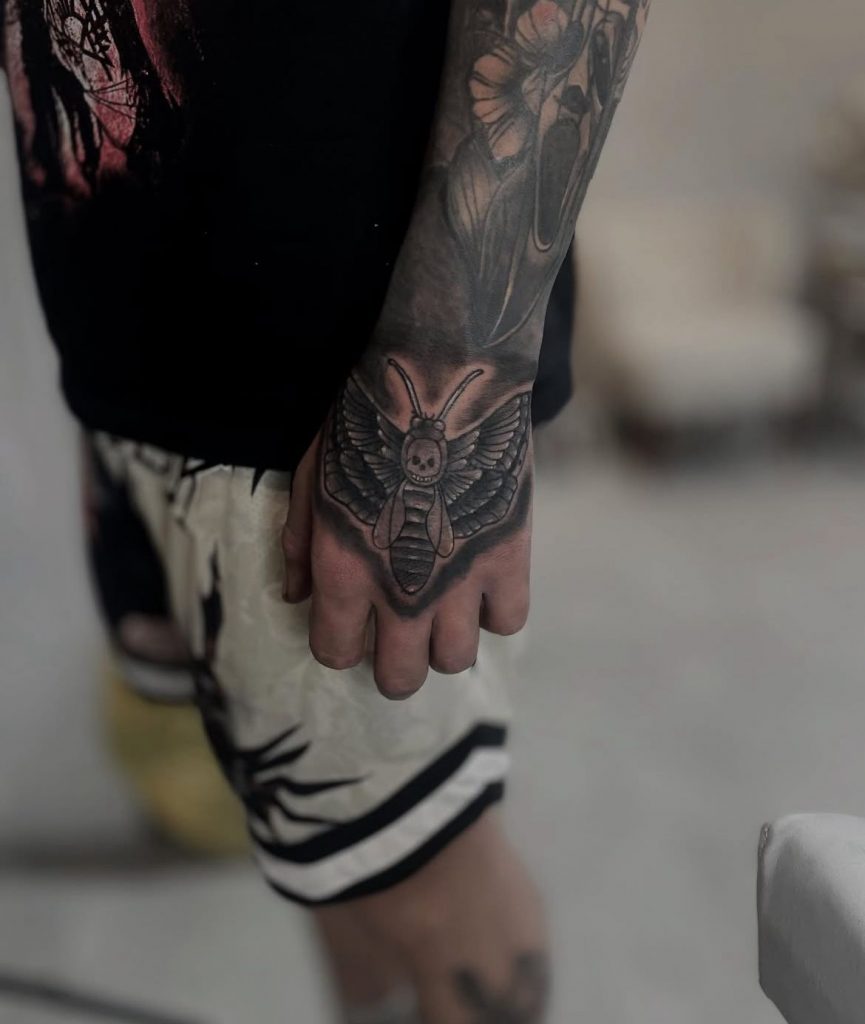 e0d311d6-fef1-4c7c-a837-984d7c38c729 Detailed black and grey hand tattoo by Loren at Kimmer Ink Tattoo Studio in Eastleigh, Hampshire.