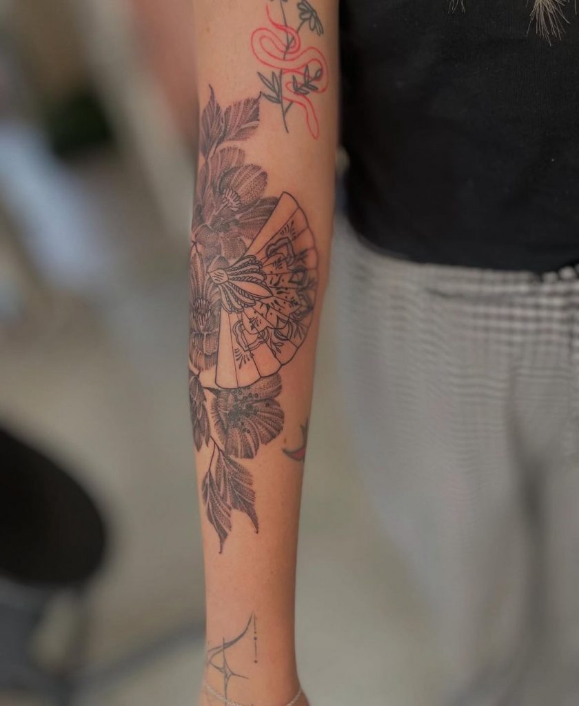 eee5db1f-1854-4269-bccd-46ee4c54b423 Illustrative black and grey arm tattoo of a bird and foliage by Loren at Kimmer Ink Tattoo Studio in Eastleigh, Hampshire.