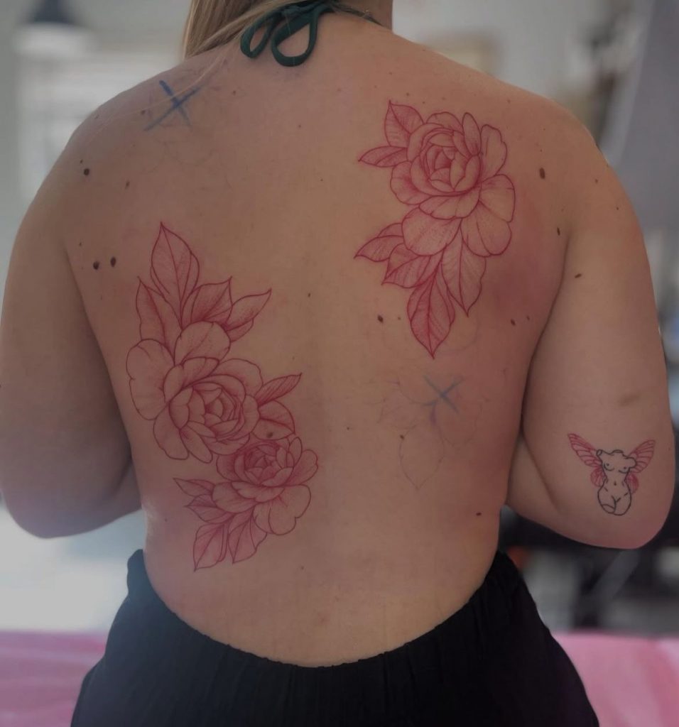 f4725f3c-079c-4124-88d8-f9ebce2f2b3c Red floral back tattoo of peonies by Loren at Kimmer Ink Tattoo Studio in Eastleigh, Hampshire.